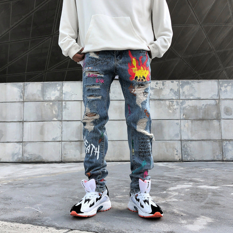 Graffiti print ripped jeans
